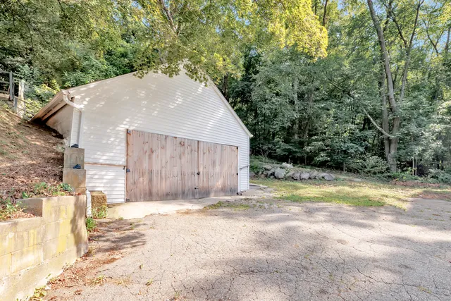 a view of a backyard of the house