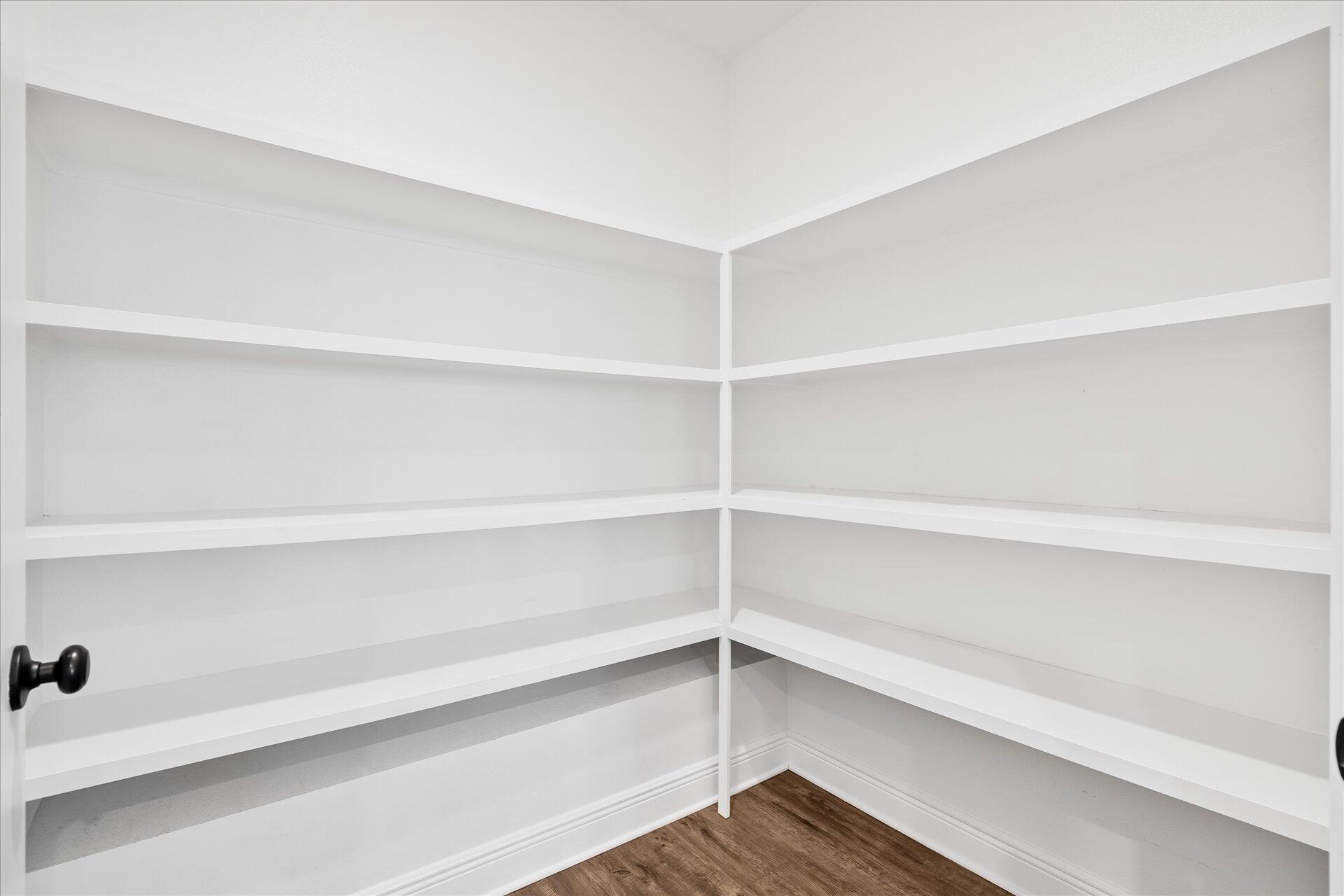 8934 Skip Stone Road Milton, FL 32583 - Photo 22 of 55 a view of walk in closet with empty racks