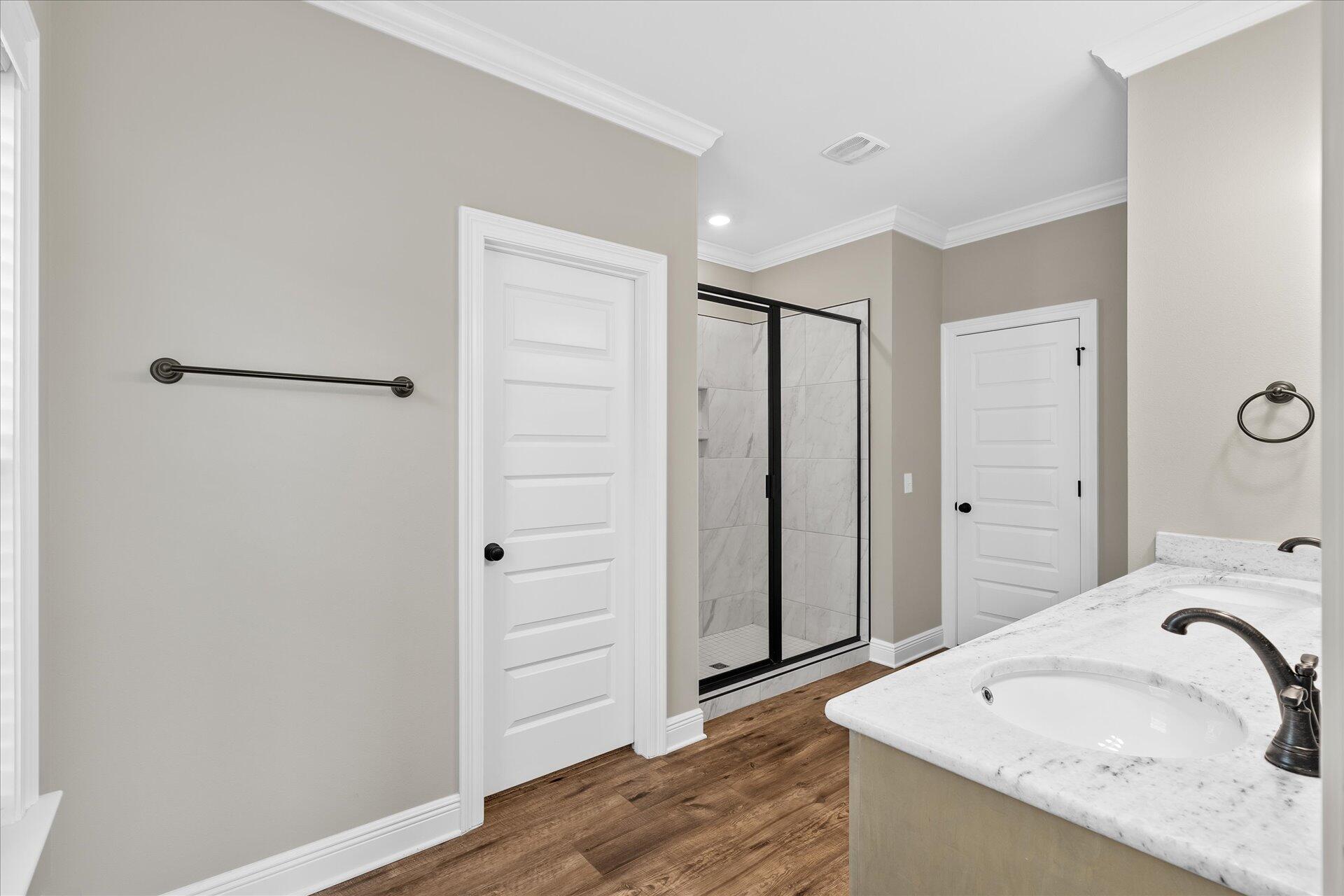 8934 Skip Stone Road Milton, FL 32583 - Photo 29 of 55 a bathroom with a sink and a mirror