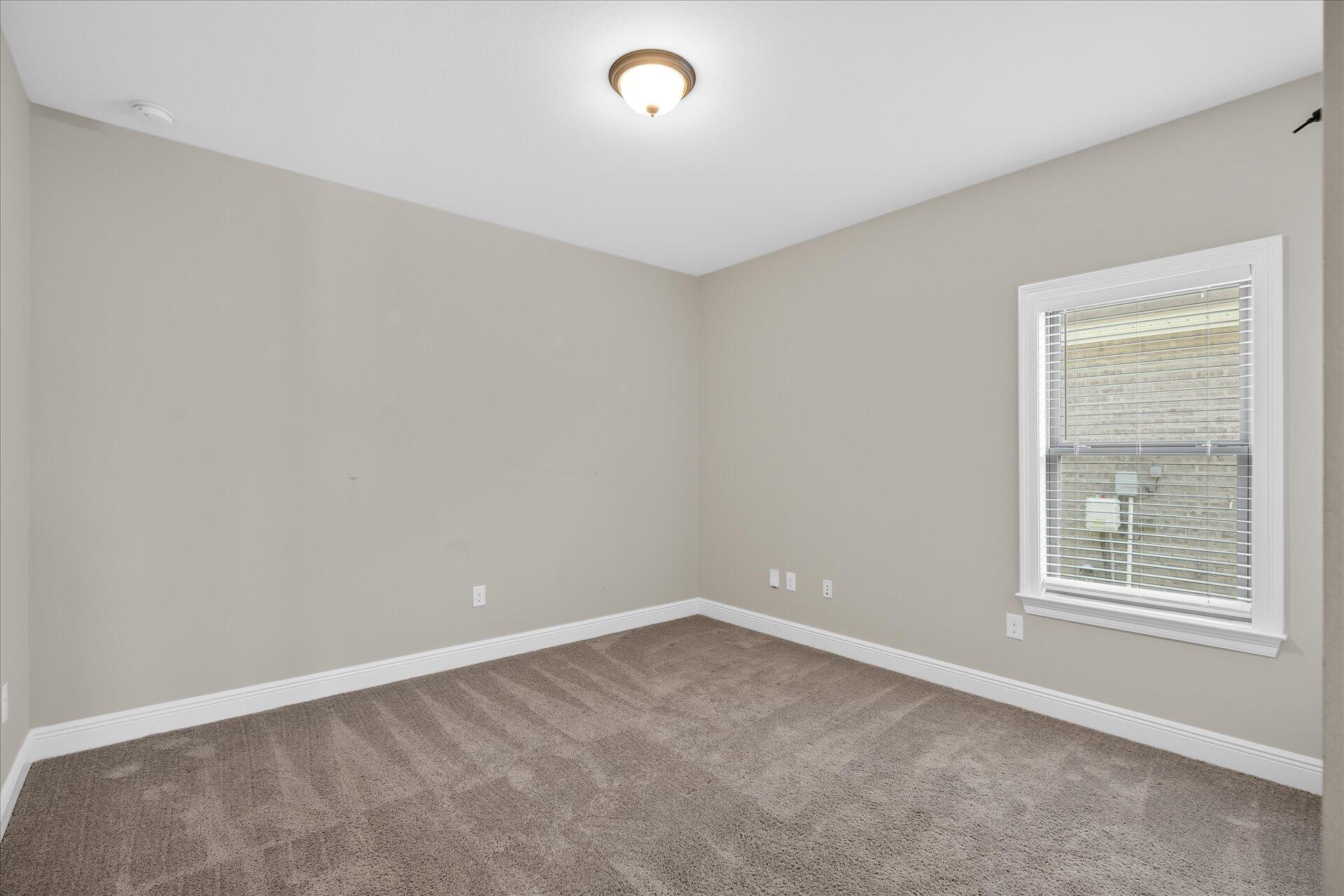 8934 Skip Stone Road Milton, FL 32583 - Photo 36 of 55 an empty room with a empty space and a window