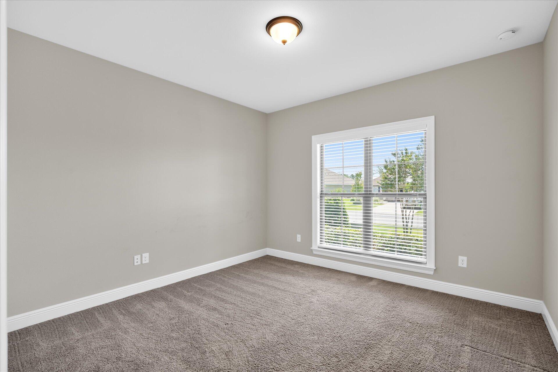 8934 Skip Stone Road Milton, FL 32583 - Photo 38 of 55 an empty room with a window