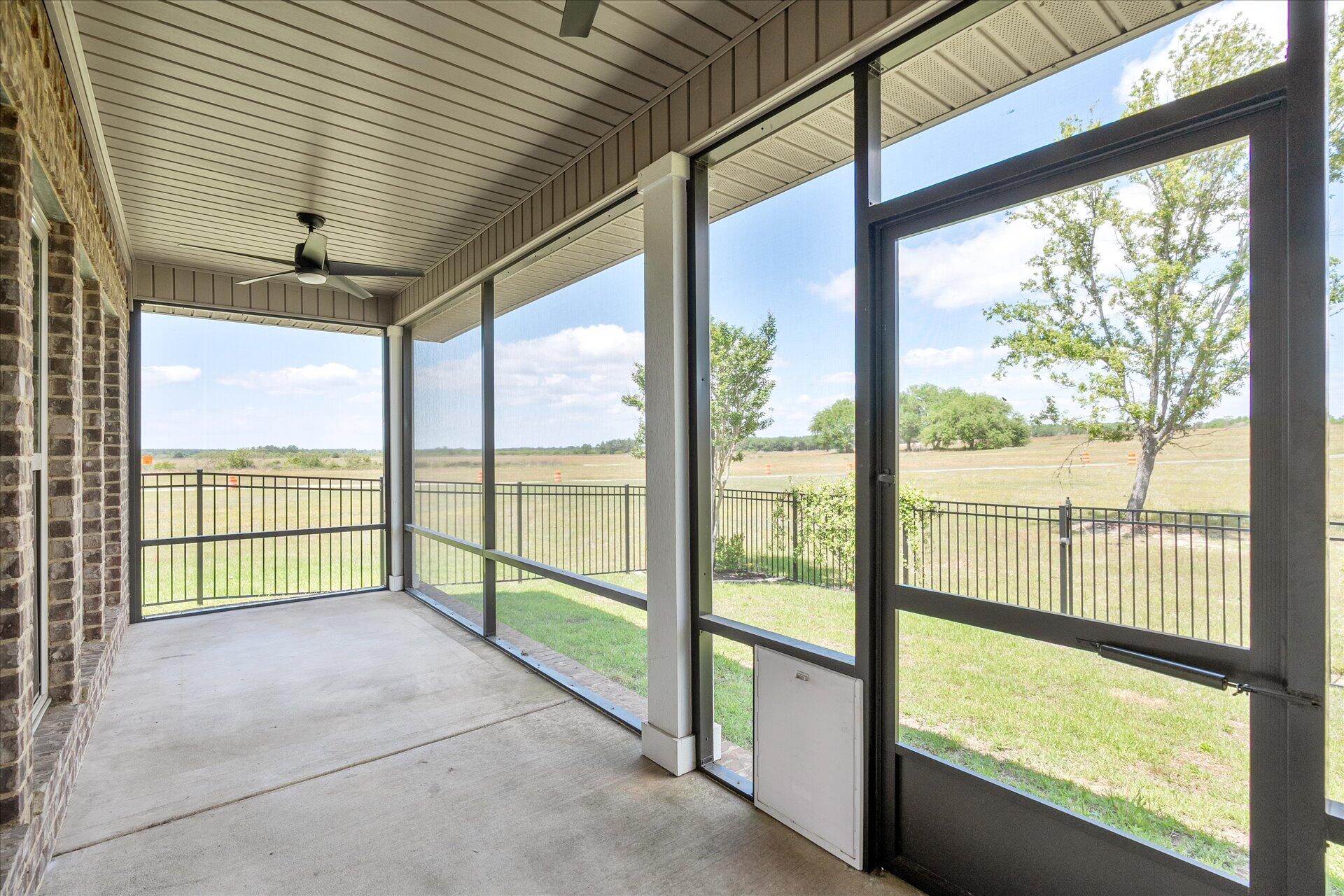 8934 Skip Stone Road Milton, FL 32583 - Photo 39 of 55 a view of an empty room with a large window