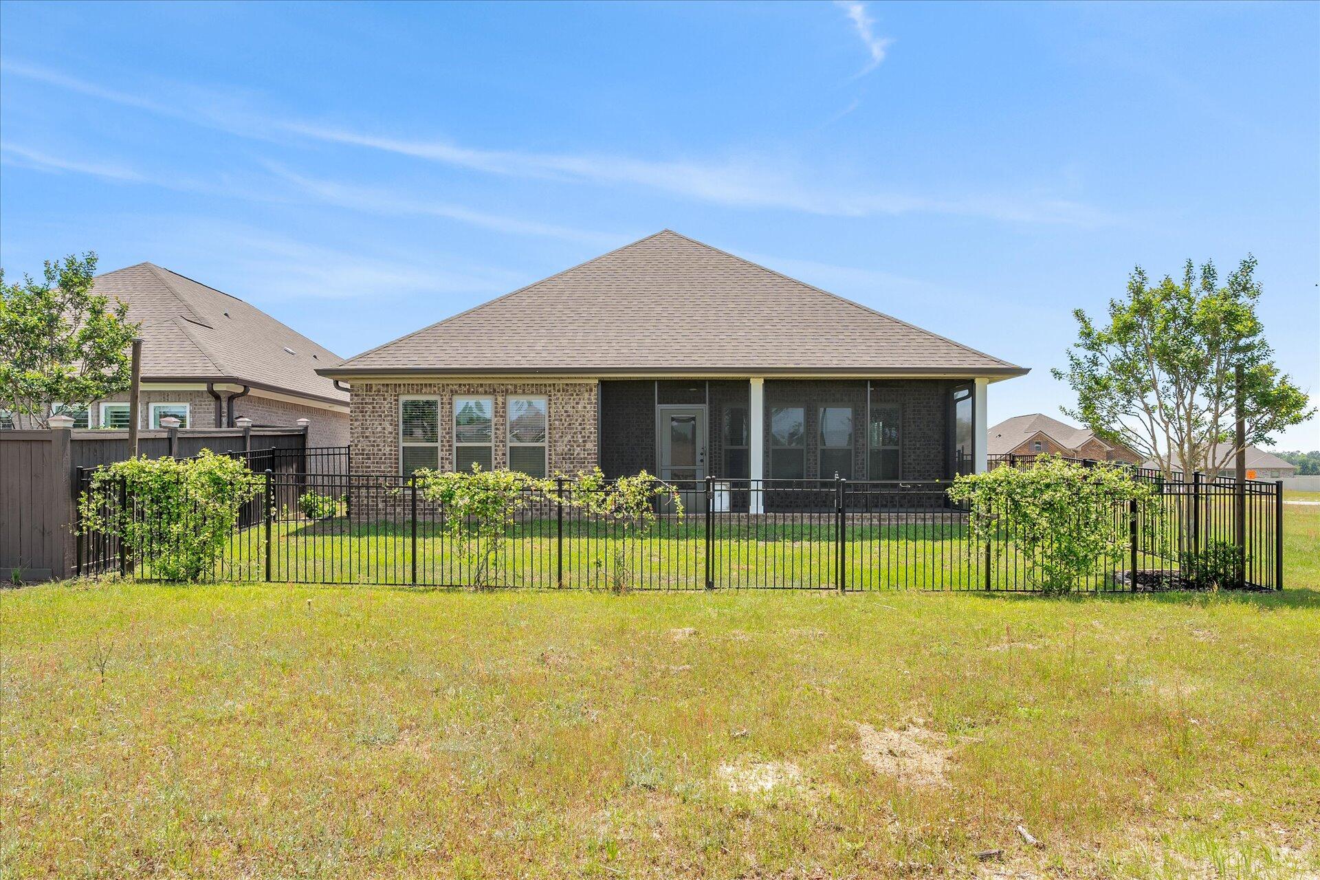 8934 Skip Stone Road Milton, FL 32583 - Photo 44 of 55 a house with swimming pool in front of it