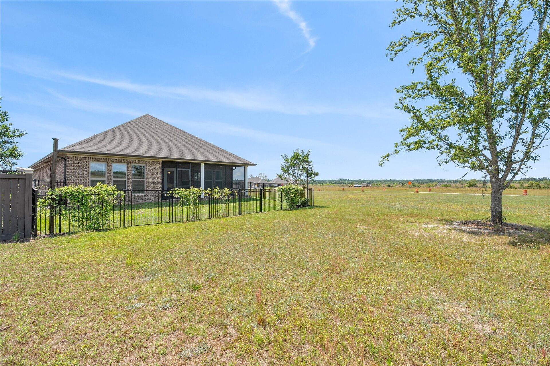8934 Skip Stone Road Milton, FL 32583 - Photo 45 of 55 a house with swimming pool in front of it