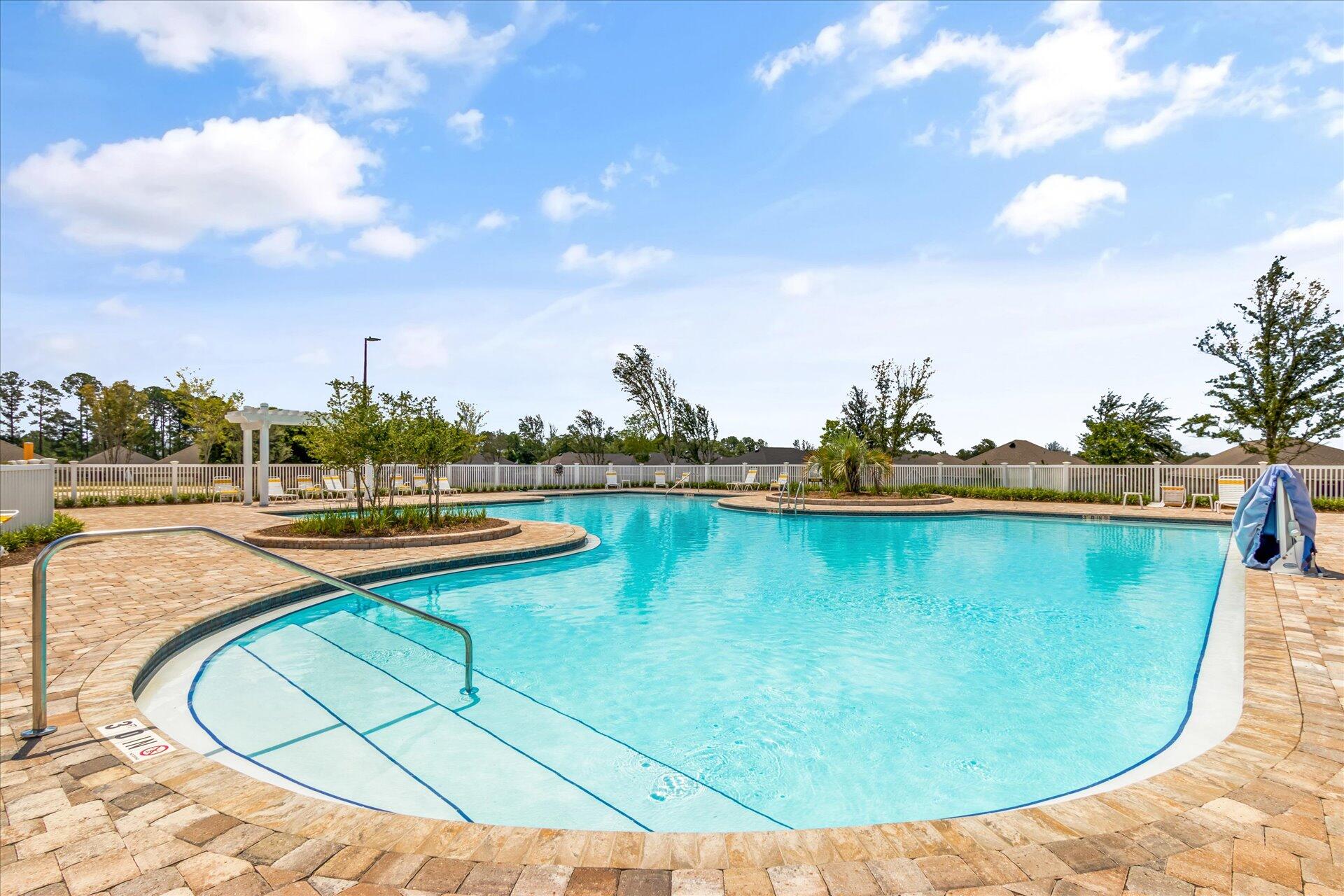 8934 Skip Stone Road Milton, FL 32583 - Photo 52 of 55 a view of a swimming pool with a lake