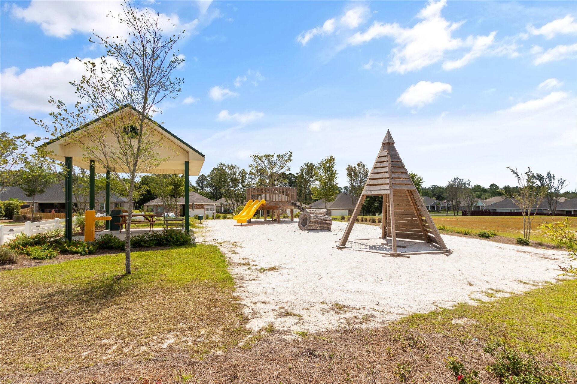 8934 Skip Stone Road Milton, FL 32583 - Photo 53 of 55 a view of a swimming pool with a lounge chairs