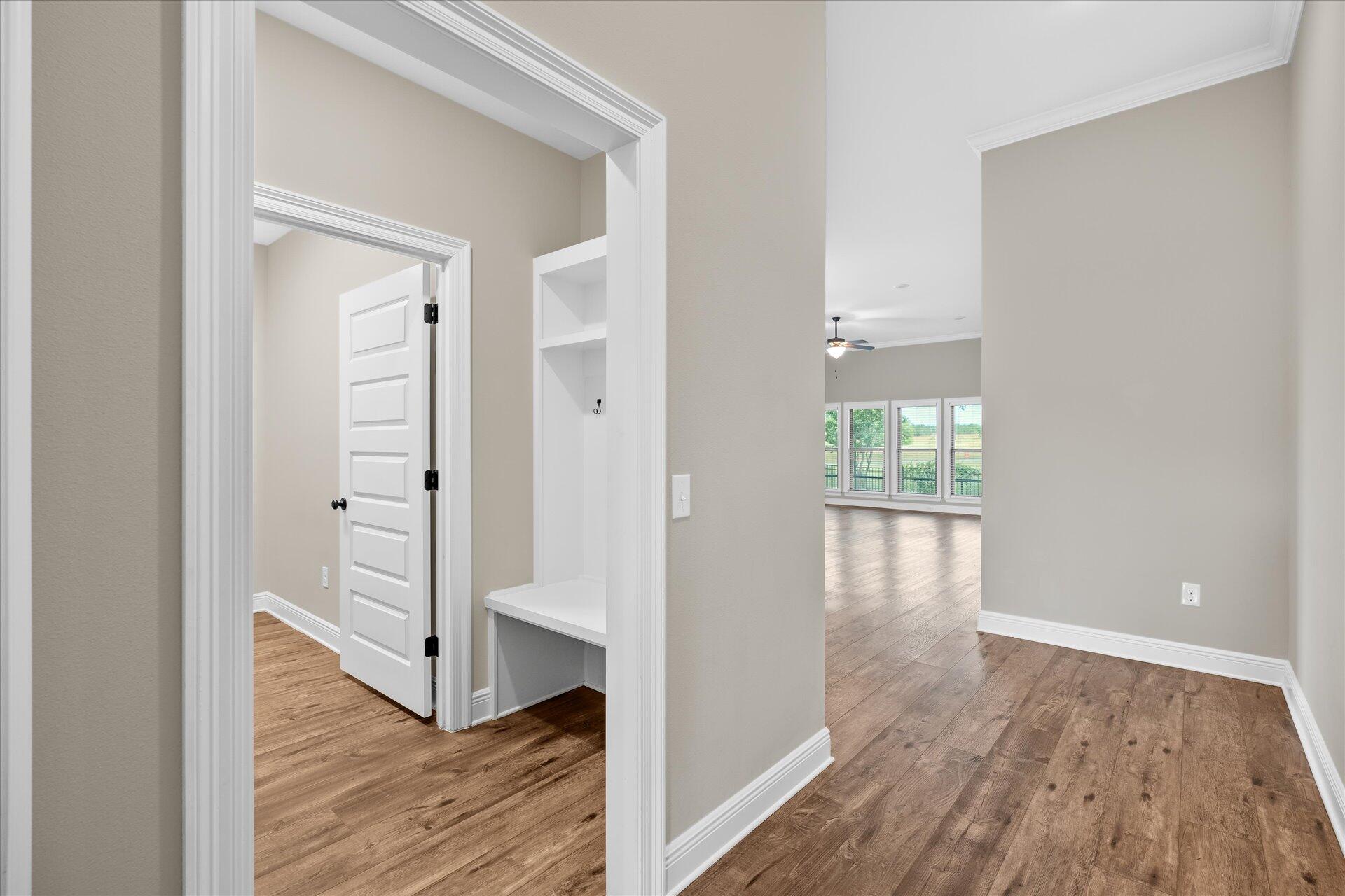 8934 Skip Stone Road Milton, FL 32583 - Photo 8 of 55 a view of wooden floor and windows in a room