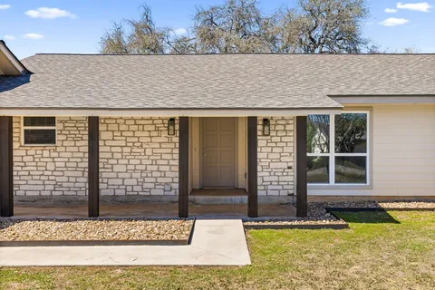 front view of a house with a yard