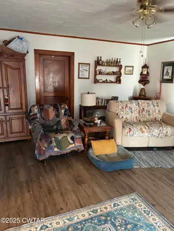 a room with furniture and wooden floor