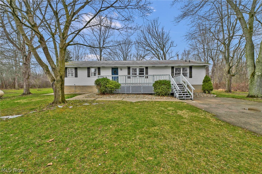 259 East Ohio Avenue Rittman, OH 44270 - Photo 1 of 41 Ranch-style home with a front lawn and deck