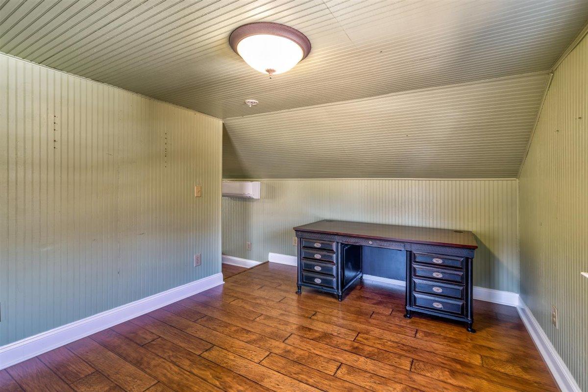 2717 Thompson Ridge Road Ferrum, VA 24088 - Photo 14 of 25 a room with wooden floors and a fireplace