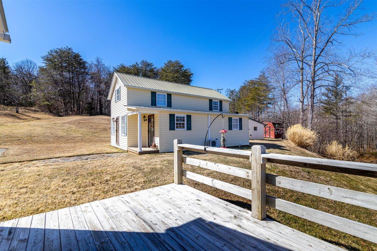 2717 Thompson Ridge Road Ferrum, VA 24088 - Photo 17 of 25 a view of a house with backyard and trees