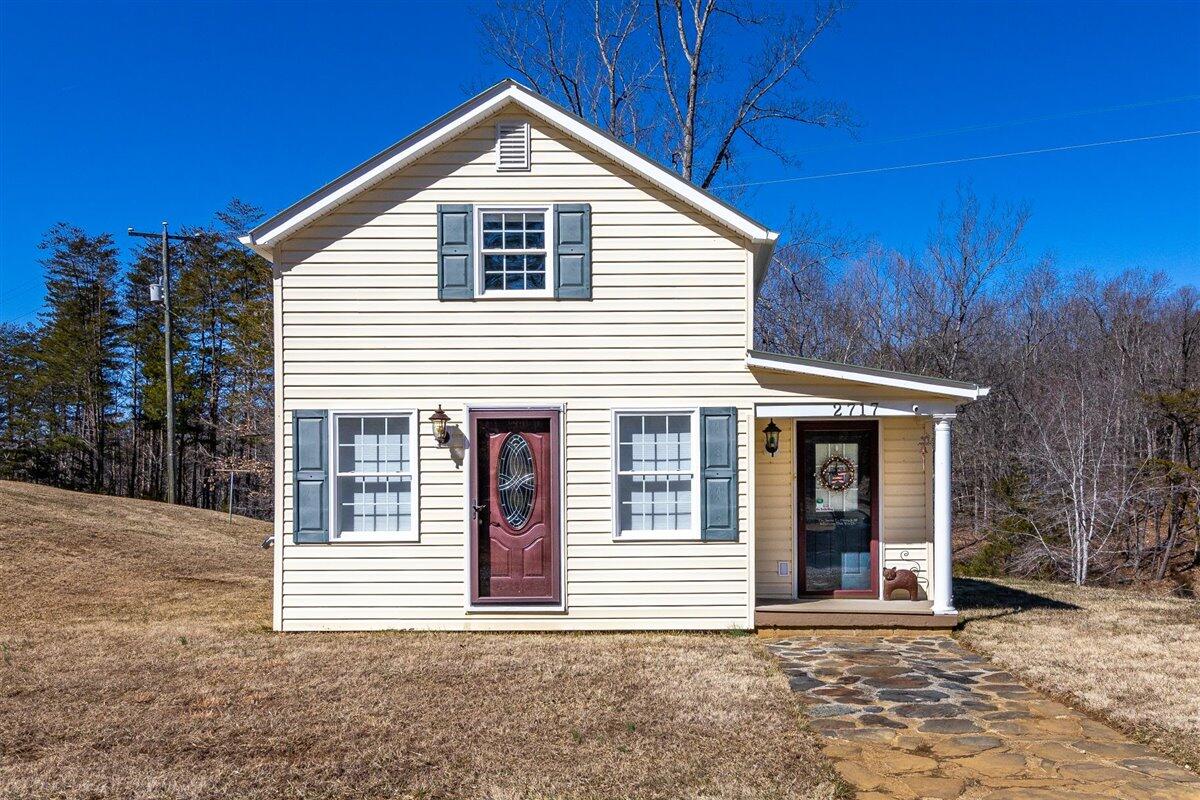 2717 Thompson Ridge Road Ferrum, VA 24088 - Photo 3 of 25 a front view of a house with a yard