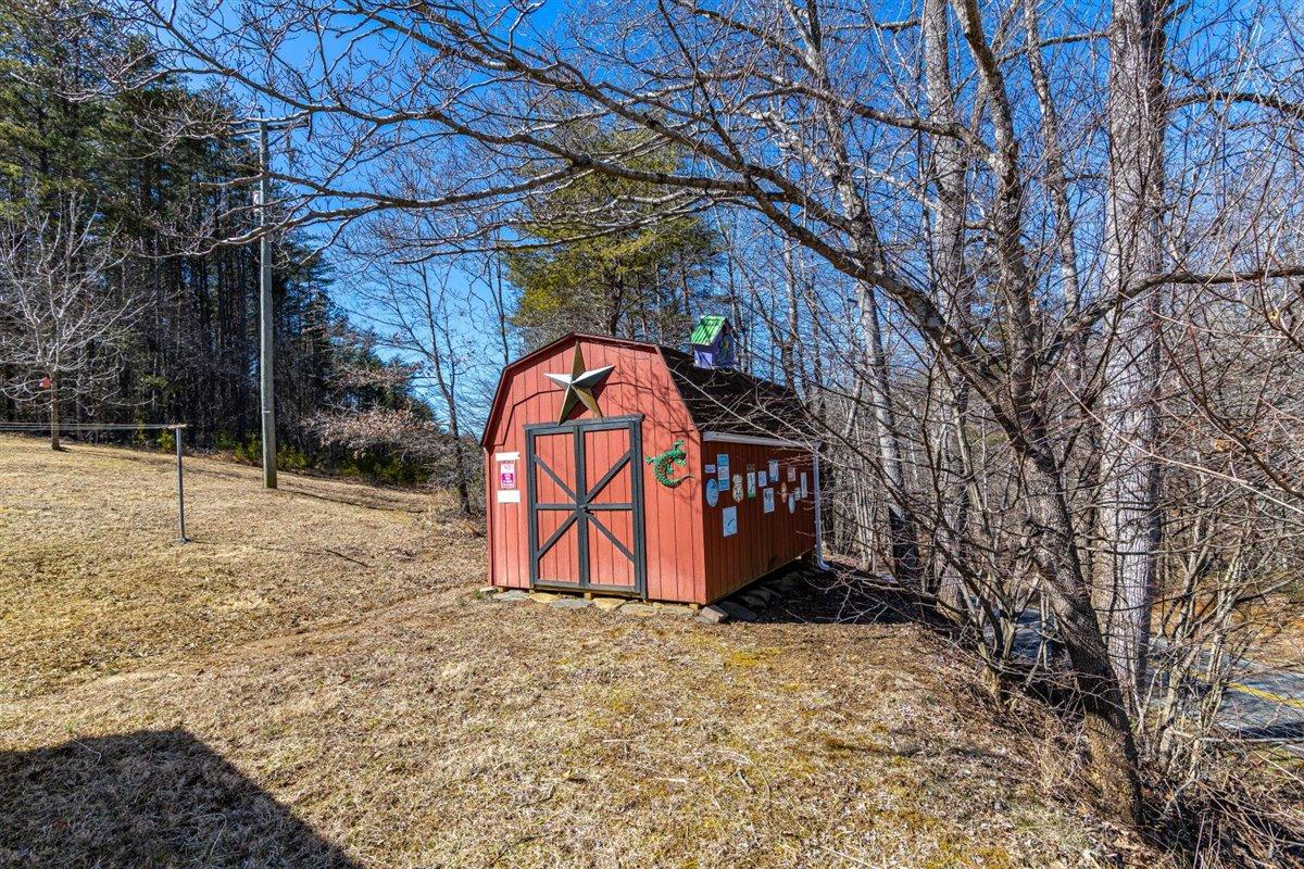 2717 Thompson Ridge Road Ferrum, VA 24088 - Photo 21 of 25 a view of outdoor space with a sign board