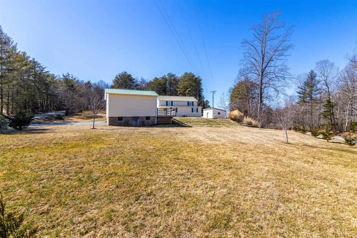 2717 Thompson Ridge Road Ferrum, VA 24088 - Photo 24 of 25 a view of a house with a yard covered with snow