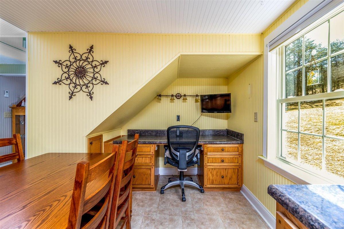 2717 Thompson Ridge Road Ferrum, VA 24088 - Photo 8 of 25 a view of a workspace with furniture and a window
