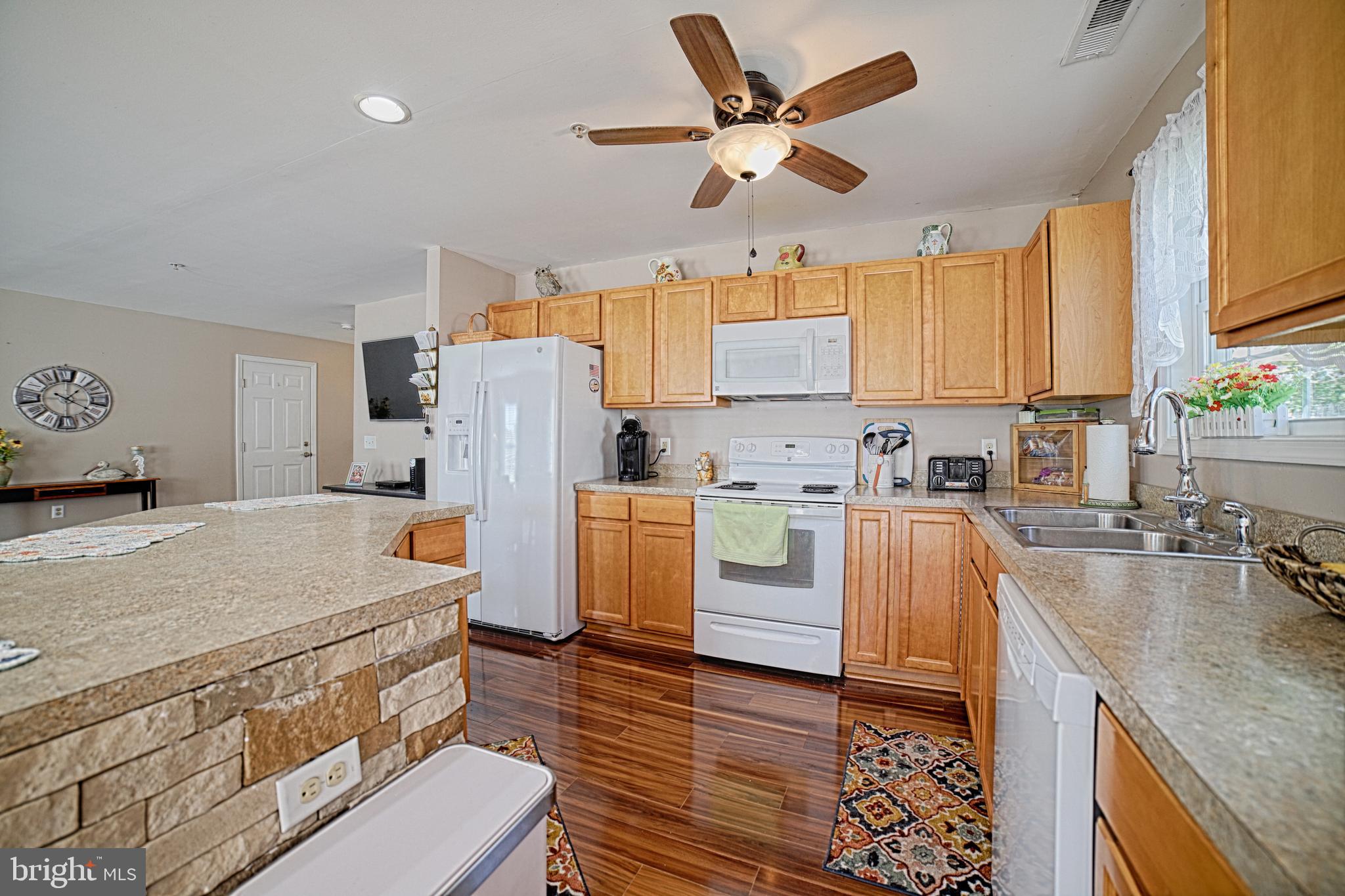 130 Walnut Street Ridgely, MD 21660 - Photo 12 of 27 a kitchen with a stove a refrigerator and a sink