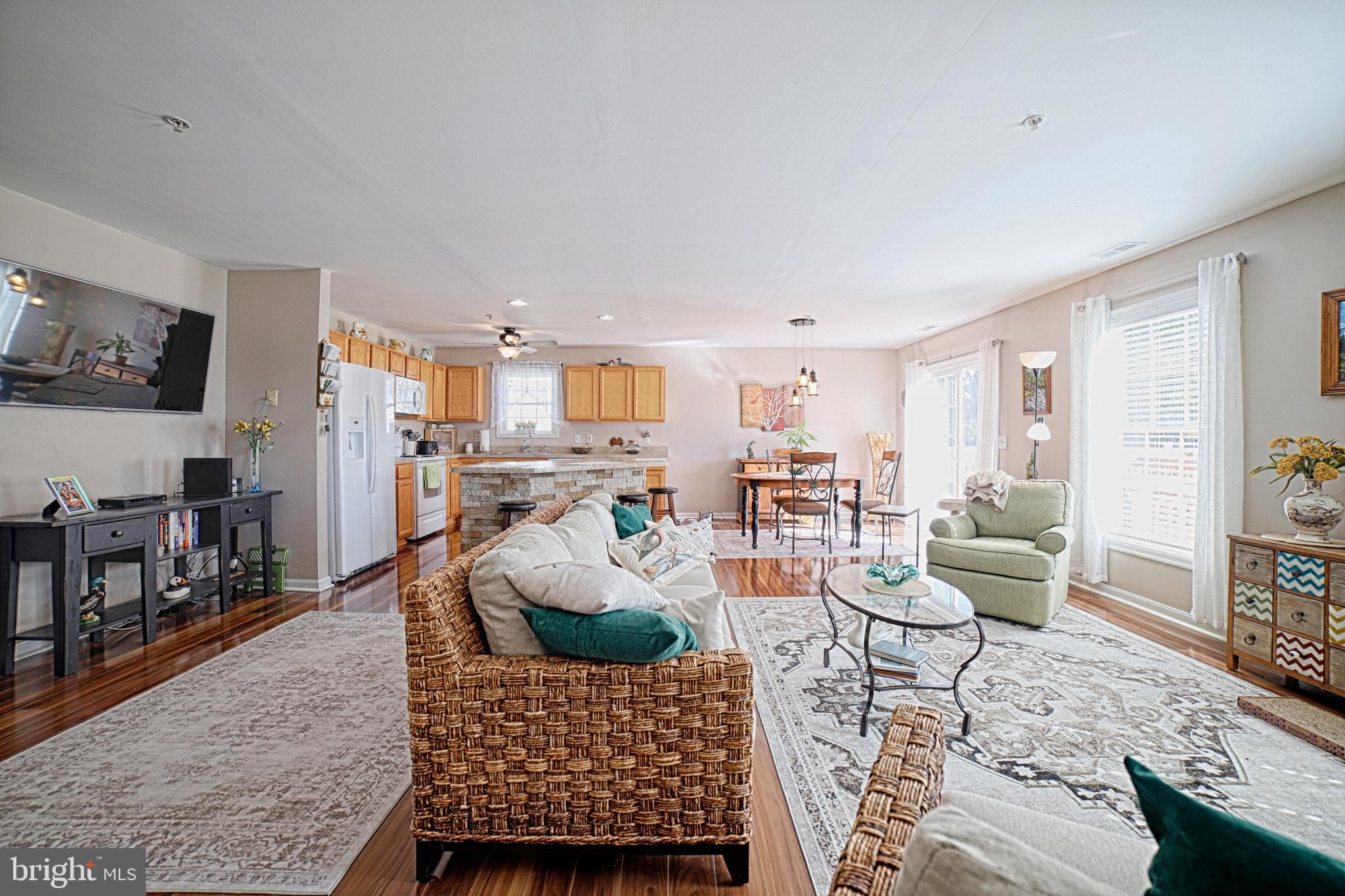 130 Walnut Street Ridgely, MD 21660 - Photo 19 of 27 a living room with furniture and a dining table with rug kitchen