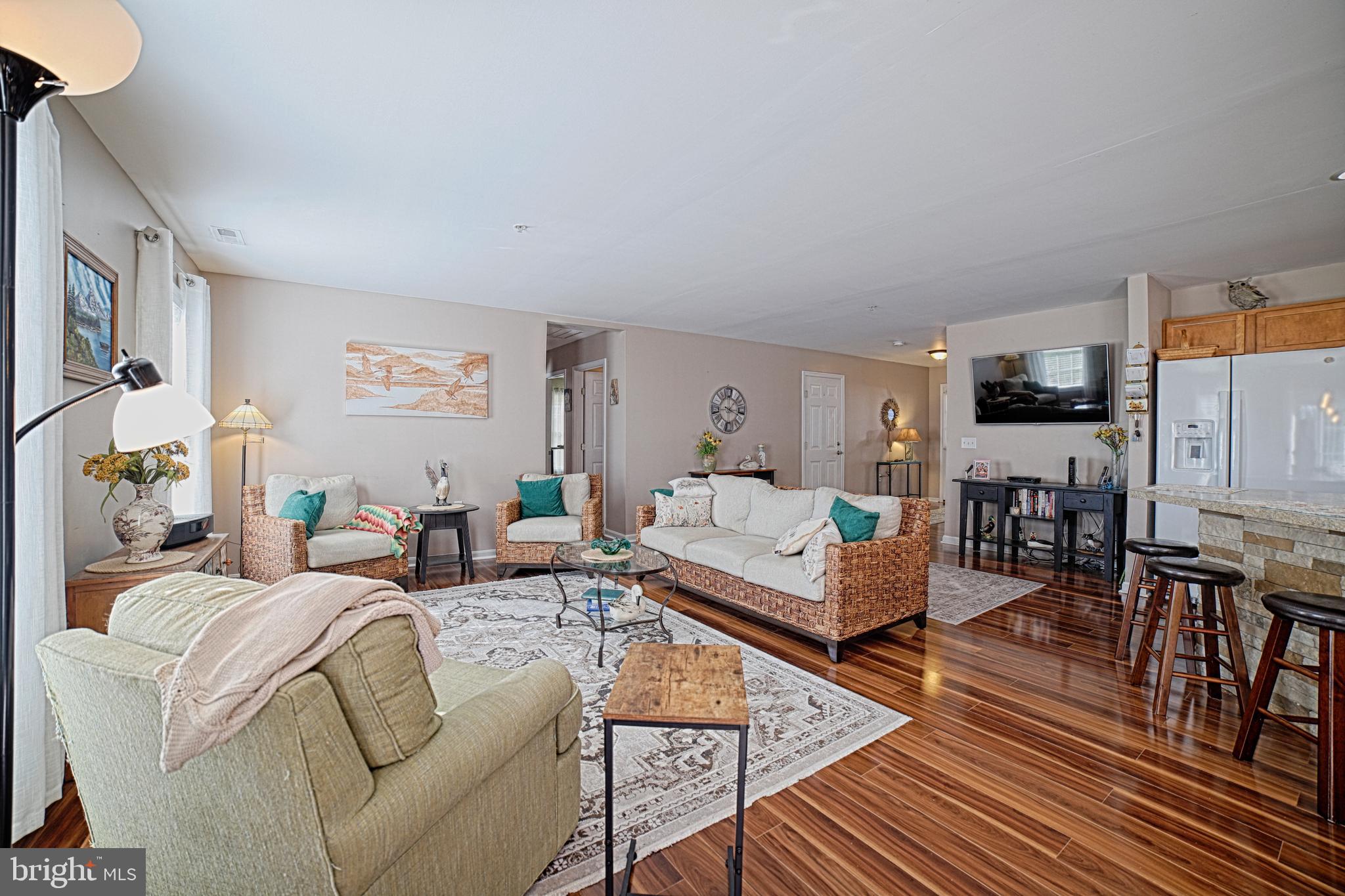 130 Walnut Street Ridgely, MD 21660 - Photo 21 of 27 a living room with furniture wooden floor and a view of kitchen
