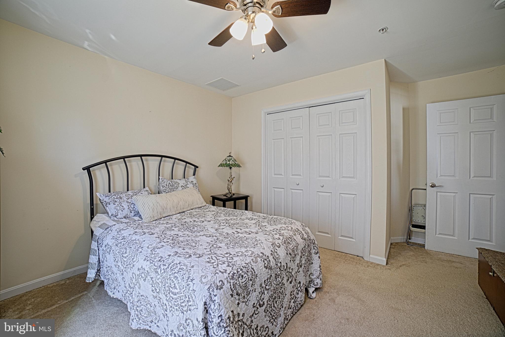 130 Walnut Street Ridgely, MD 21660 - Photo 27 of 27 a bedroom with a bed and ceiling fan