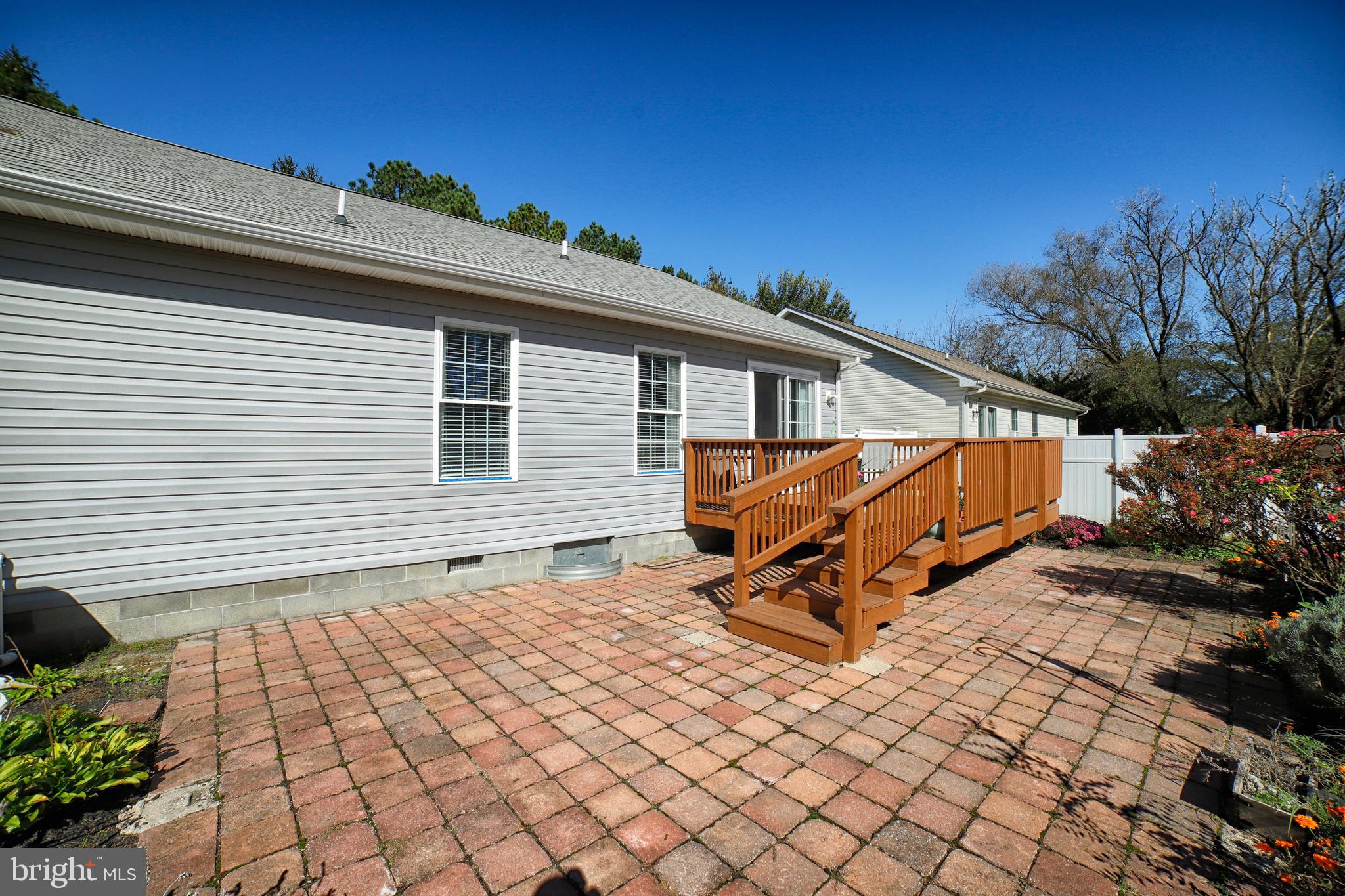 130 Walnut Street Ridgely, MD 21660 - Photo 6 of 27 a backyard of a house with wooden fence and trees