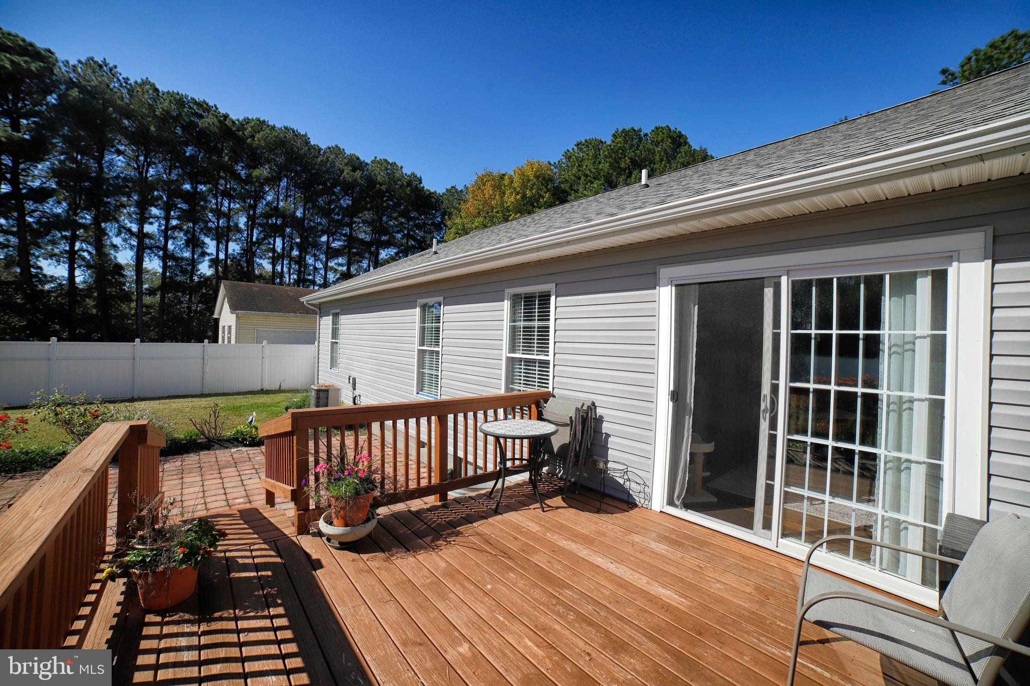 130 Walnut Street Ridgely, MD 21660 - Photo 7 of 27 a view of balcony with wooden floor and outdoor seating