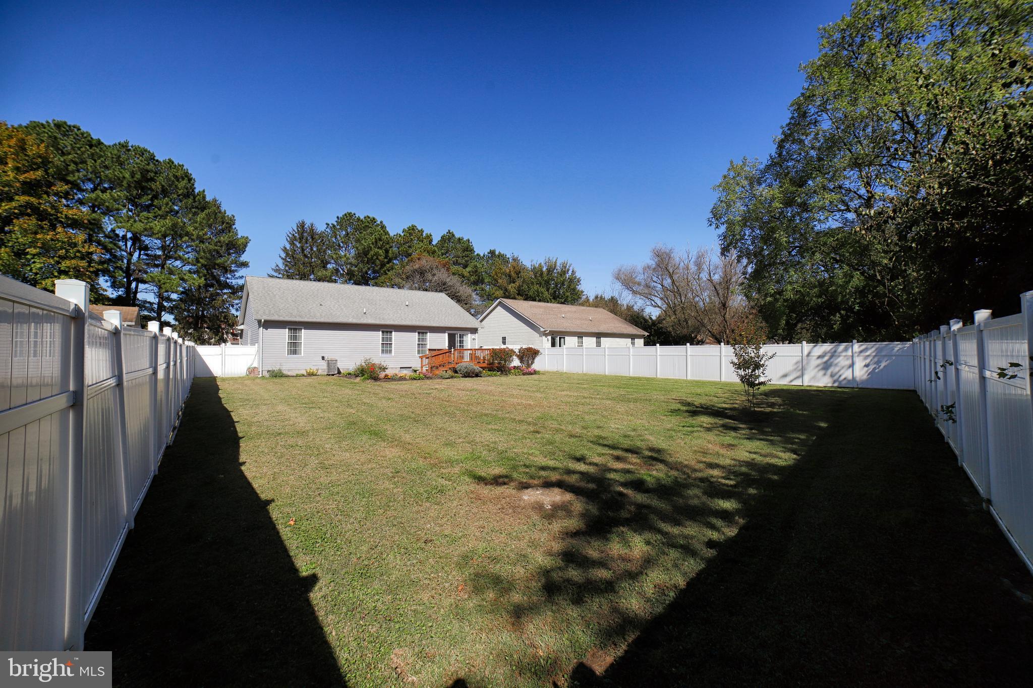 130 Walnut Street Ridgely, MD 21660 - Photo 8 of 27 a view of a house with backyard and trees