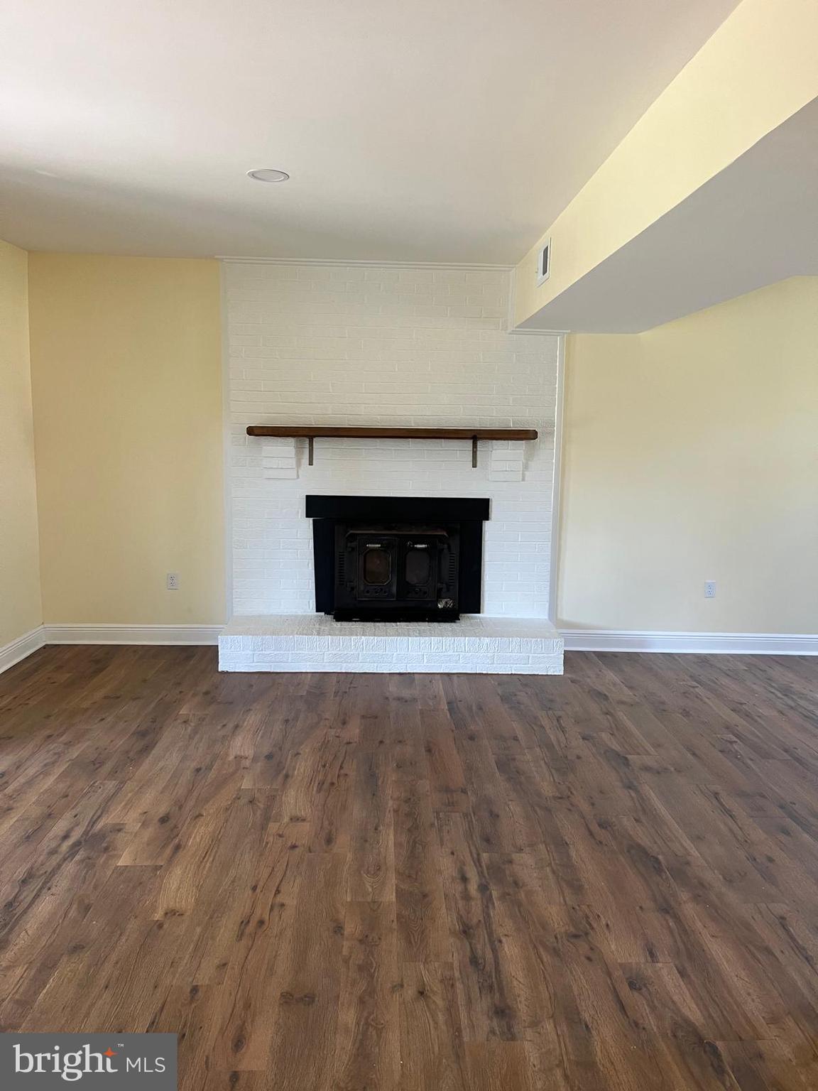 6706 Surratts Road Clinton, MD 20735 - Photo 11 of 24 a view of empty room with wooden floor