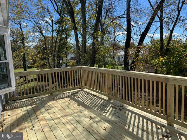 6706 Surratts Road Clinton, MD 20735 - Photo 19 of 24 a view of a wooden roof deck
