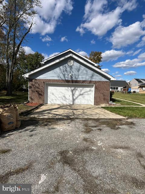 6706 Surratts Road Clinton, MD 20735 - Photo 22 of 24 a front view of a house with a yard