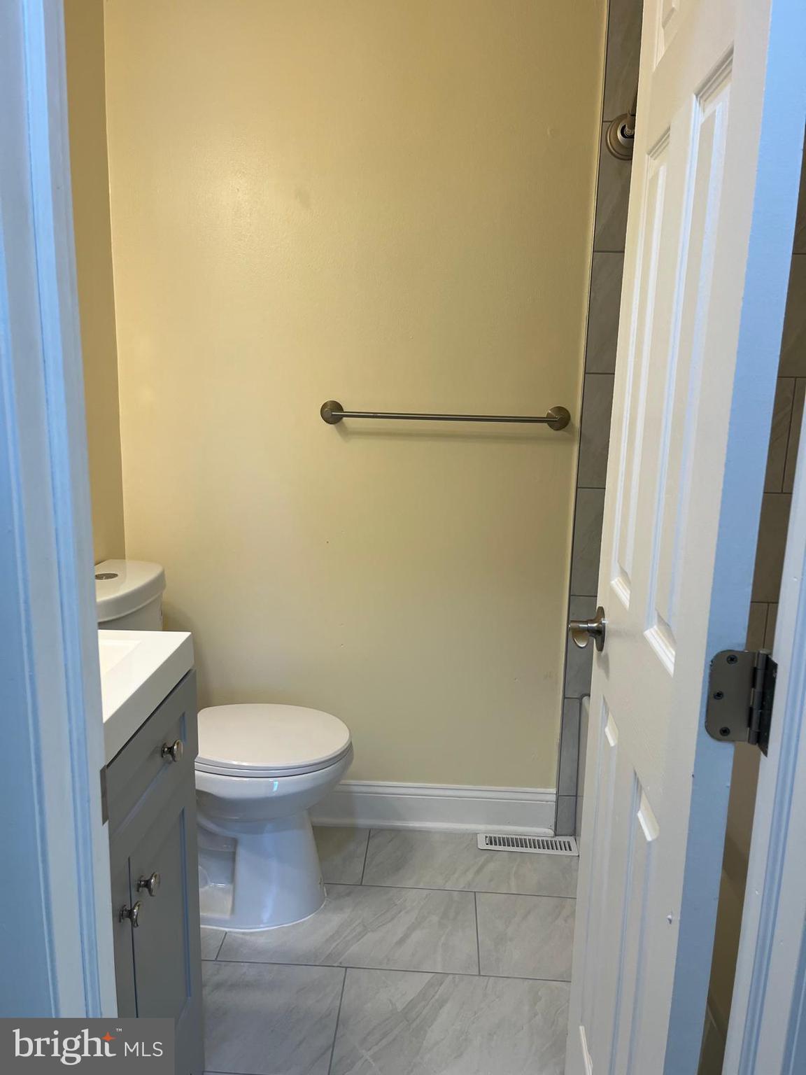 6706 Surratts Road Clinton, MD 20735 - Photo 7 of 24 a bathroom with a toilet and a shower