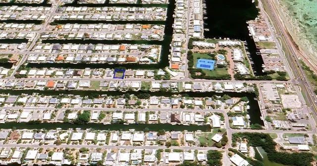 a view of a swimming pool with a yard