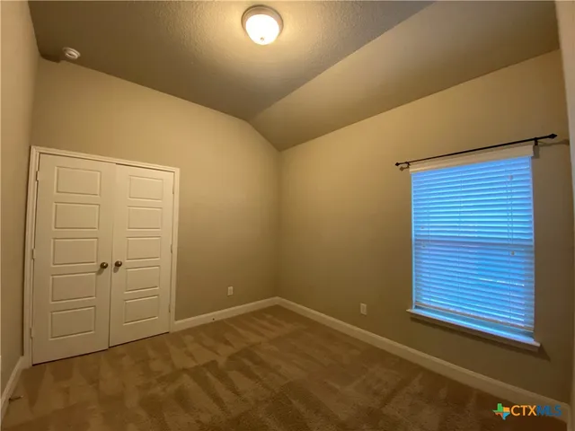 en empty room with windows