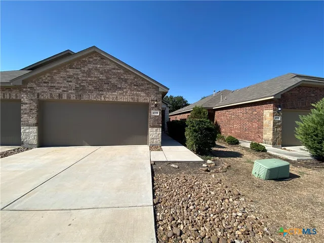 a view of a house with a patio