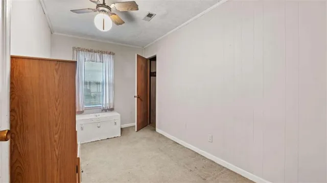 a view of room with hallway and wooden floor