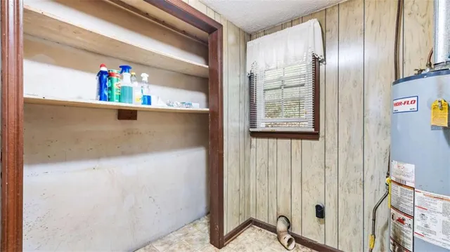 a bed room with a bed and a chandelier