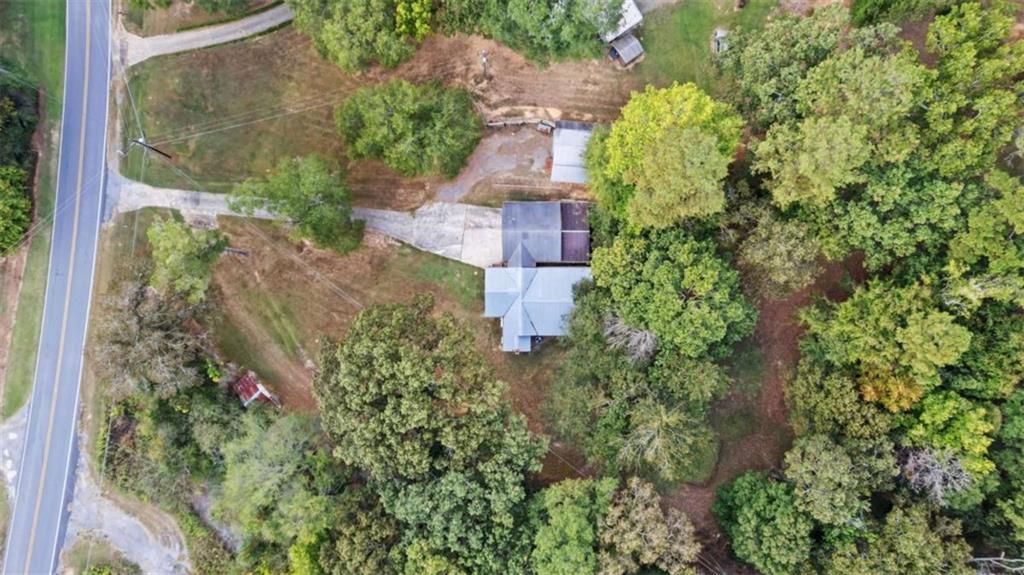 2557 Wax Road Southeast Aragon, GA 30104 - Photo 18 of 18 an aerial view of residential house with outdoor space and trees all around