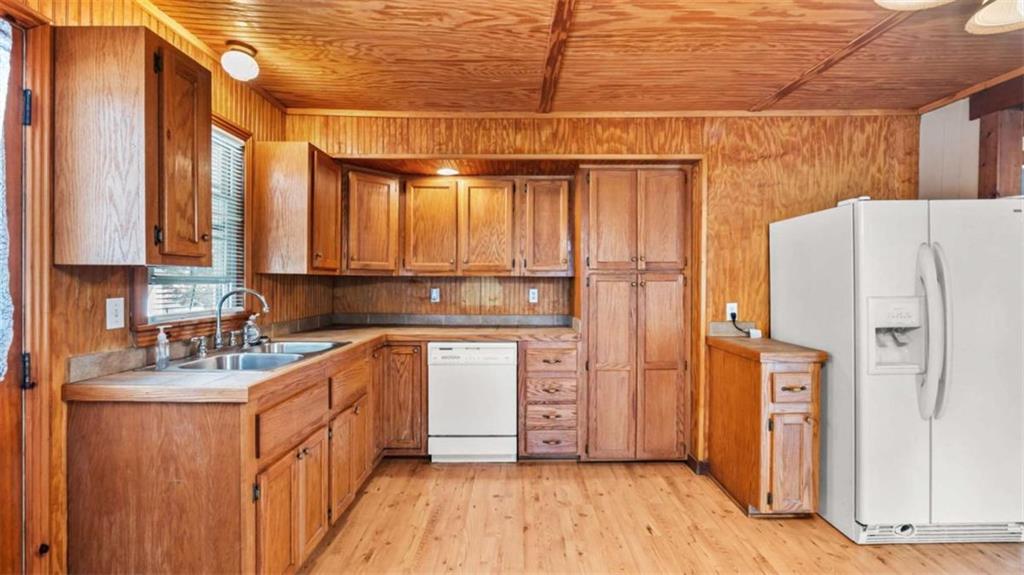 2557 Wax Road Southeast Aragon, GA 30104 - Photo 6 of 18 a kitchen with stainless steel appliances a refrigerator and a stove top oven