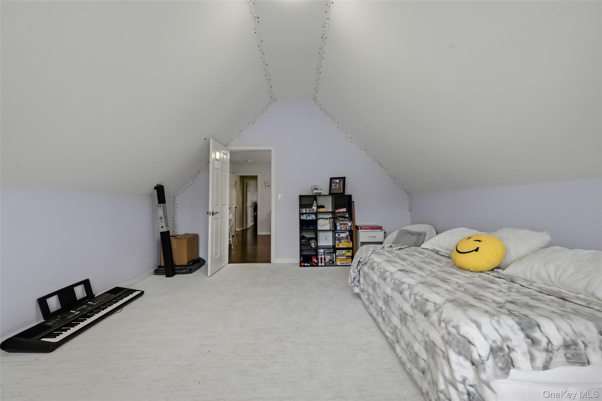 51 Meriwether Trail Congers, NY 10920 - Photo 32 of 50 Room with sloped ceilings, light-colored carpeting, and a white interior door