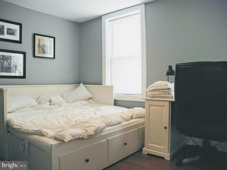 1933 Rodman Street Philadelphia, PA 19146 - Photo 11 of 21 a bedroom with a bed and a window