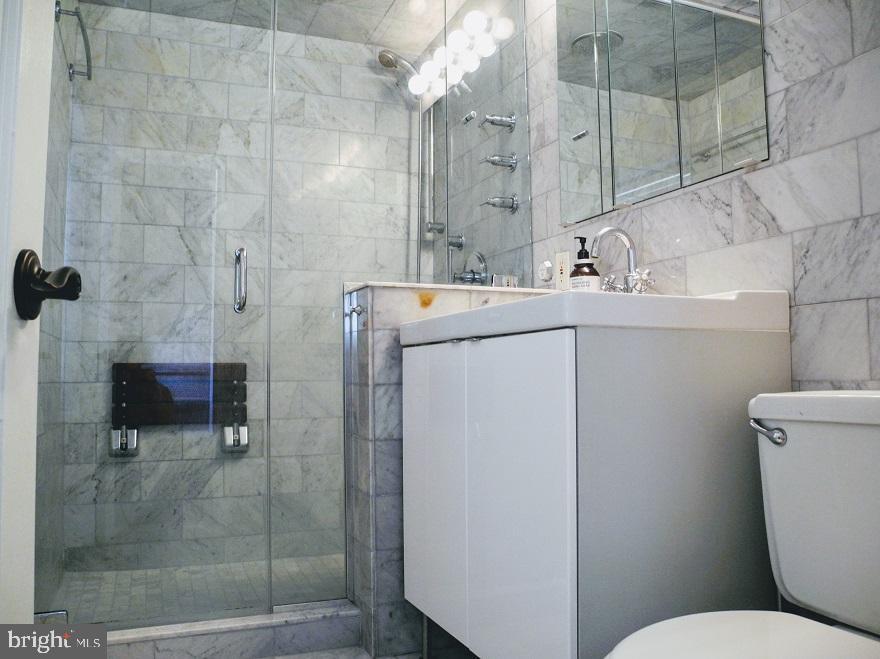 1933 Rodman Street Philadelphia, PA 19146 - Photo 13 of 21 a bathroom with a sink a toilet and shower