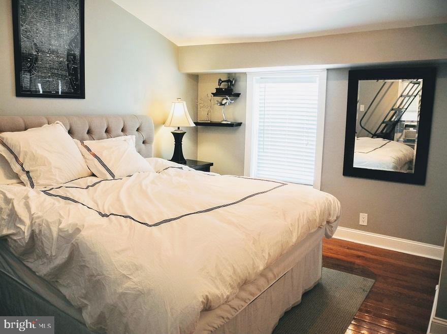 1933 Rodman Street Philadelphia, PA 19146 - Photo 14 of 21 a bedroom with a bed and a painting on the wall