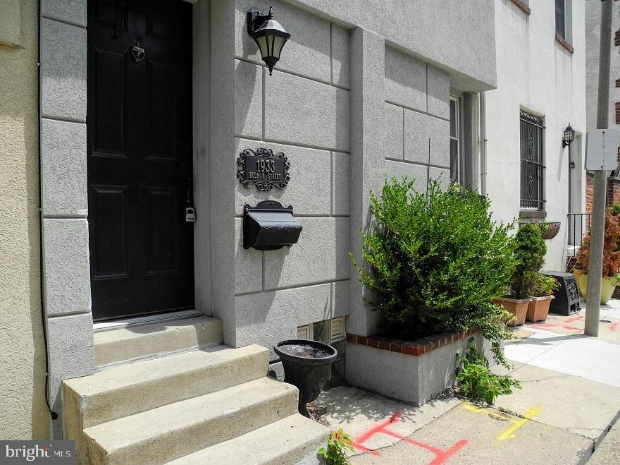 1933 Rodman Street Philadelphia, PA 19146 - Photo 20 of 21 a bedroom with a bed and a potted plant