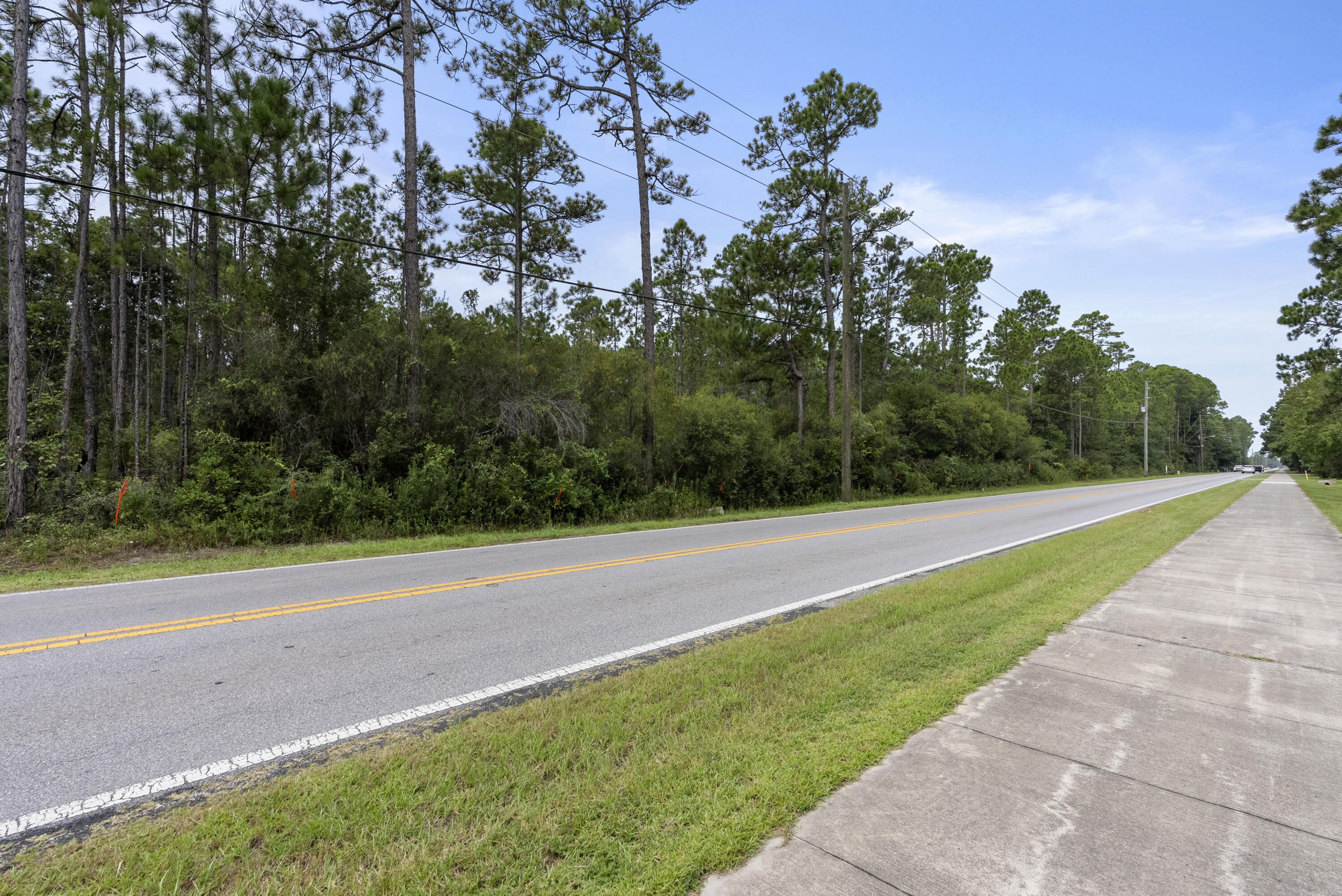Abc Abc Chat Holley Road Santa Rosa Beach, FL 32459 - Photo 8 of 14 a view of a field with a trees in the background
