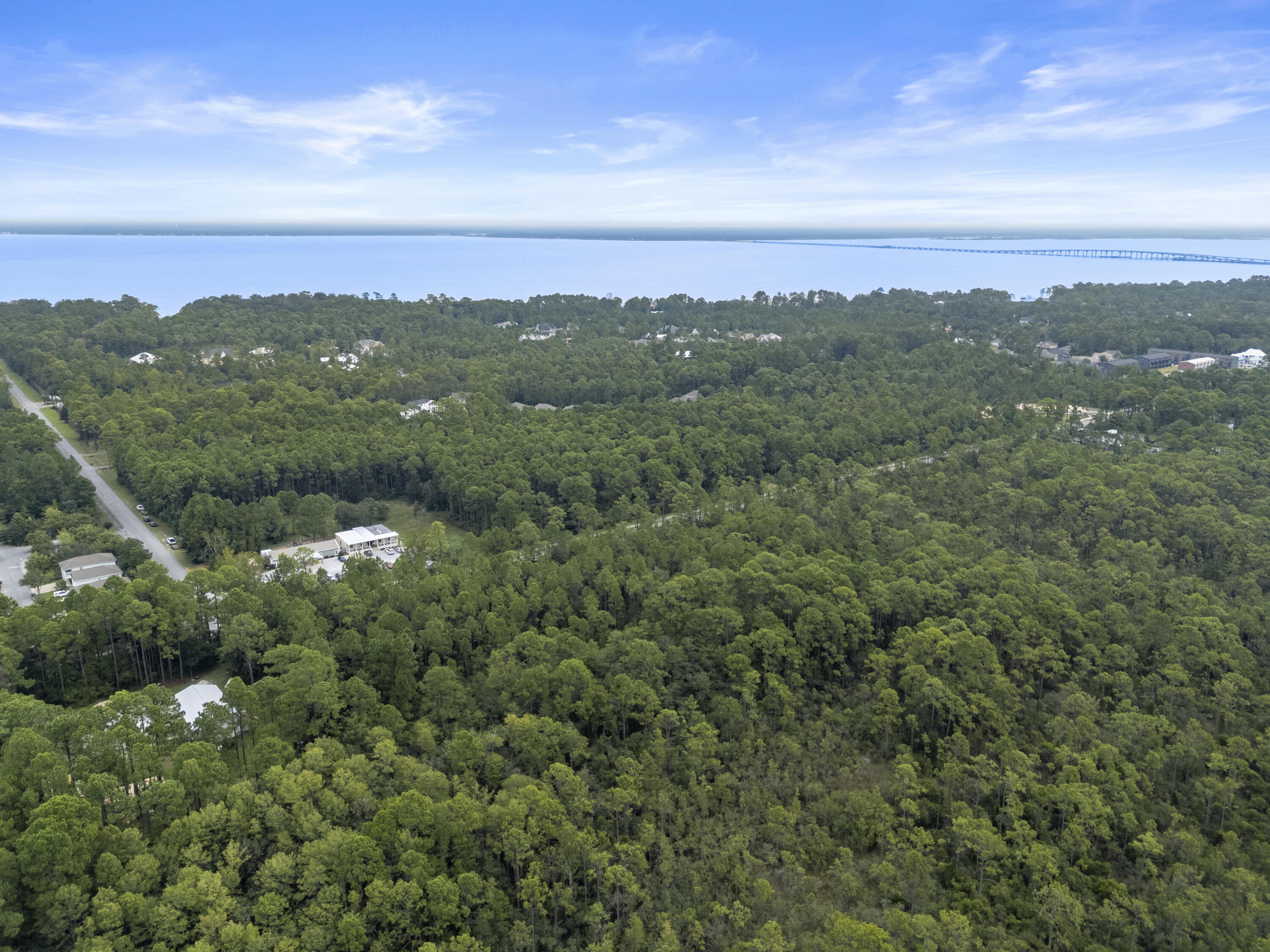 Abc Abc Chat Holley Road Santa Rosa Beach, FL 32459 - Photo 10 of 14 a view of a city with lush green forest