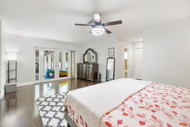 a view of a living room with wooden floor
