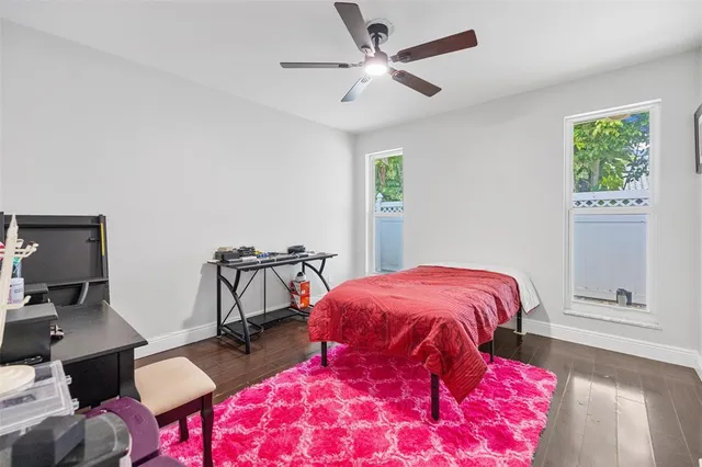 a bedroom with furniture and a window
