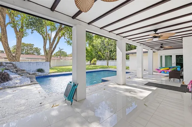 a view of a swimming pool with a patio