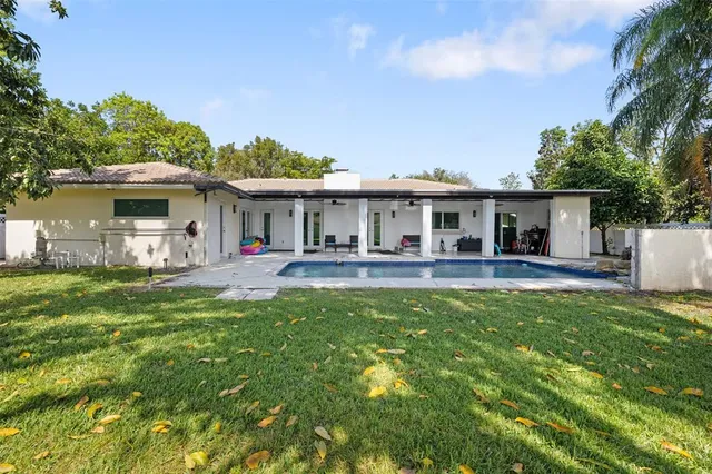 a front view of a house with a yard table and chairs
