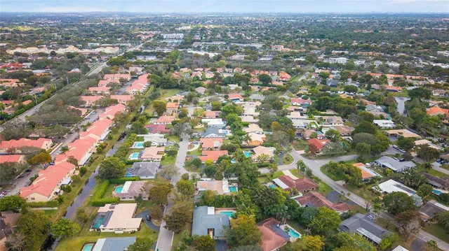 an aerial view of residential houses with city view